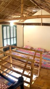 a bedroom with two bunk beds in a room at Capiz Beach Villa family room for 6 pax in Calatagan
