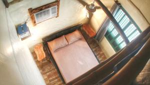 an overhead view of a bed in a room at Capiz Beach Villa family room for 6 pax in Calatagan