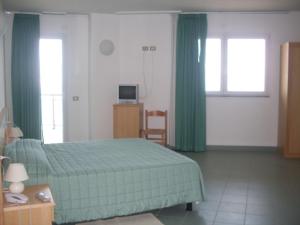 Ένα ή περισσότερα κρεβάτια σε δωμάτιο στο Hotel Soleado