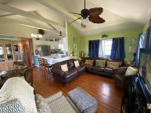 a living room with a couch and a table at Private Estate Pool Ocean View 20 minutes to Key West in Summerland Key