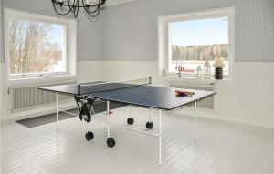 a ping pong table in the middle of a room at Stunning home in Segmon with 5 Bedrooms, Sauna and WiFi in Segmon