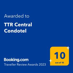 a yellow sign with the text awarded to tir central controller at TTR Central Apart Hotel in Da Lat