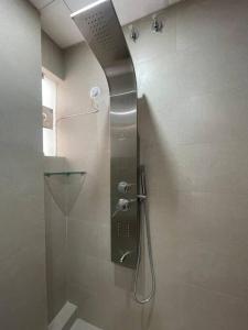 a shower with a glass door in a bathroom at Lush Green Workation Villa - 1 Bedroom in Lucknow