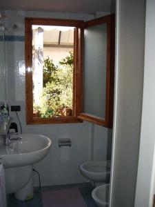 Koupelna v ubytování Albergo Villa Sorriso