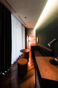 a living room with a couch and a table at LE SEOUL HOTEL in Seoul
