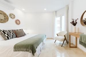 Postel nebo postele na pokoji v ubytování Lavaderos Suites