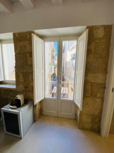 Μια τηλεόραση ή/και κέντρο ψυχαγωγίας στο Residence Le Tre Grazie - Appartamento Tàlia