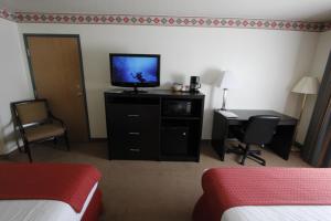 Postel nebo postele na pokoji v ubytování Ramada by Wyndham Williams/Grand Canyon Area