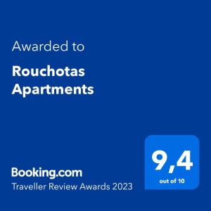 a blue sign with the text awarded to roostitious applicants at Rouchotas Apartments in Argostoli