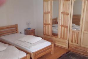 a bedroom with two twin beds and a mirror at Lomtsi Popovo Targovhiste Bulgarije in Lomtsi +33 photos