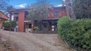 a house with a dirt road in front of it at La Casa di Francesco in Perugia