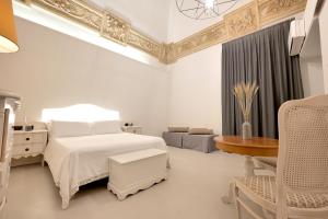 A bed or beds in a room at Dimora San Giuseppe