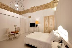 A bed or beds in a room at Dimora San Giuseppe