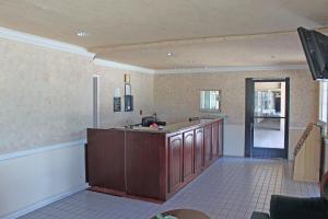 a kitchen with a sink and a counter top at Orange Tustin Inn in Orange in Orange