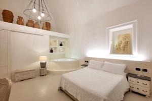 A bed or beds in a room at Dimora San Giuseppe