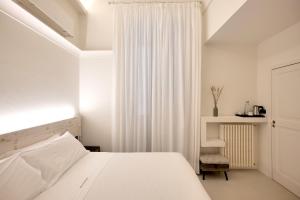 A bed or beds in a room at Dimora San Giuseppe