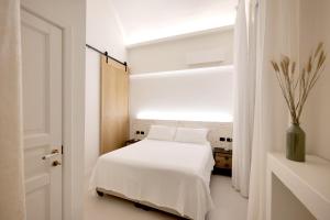 A bed or beds in a room at Dimora San Giuseppe