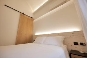 A bed or beds in a room at Dimora San Giuseppe