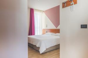 Кровать или кровати в номере Hotel Ristorante Al Fiore