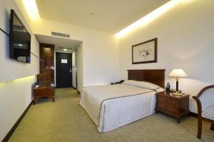 Katil atau katil-katil dalam bilik di King's Paradise Hotel