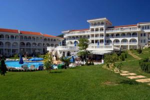 a large building with a pool in front of it at Fantastic Apartment in Sveti Vlas in Sveti Vlas