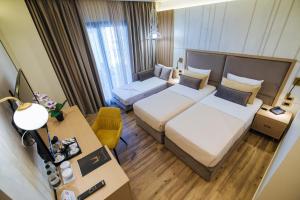 Postel nebo postele na pokoji v ubytování Gloria Palace Hotel & SPA + 37 fotografií