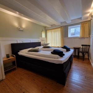 a bedroom with a large bed in a room at 't Lytse Knipke in Lemmer