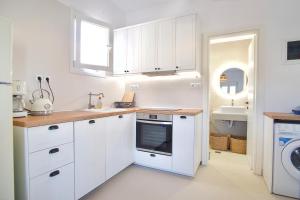 Kuchyň nebo kuchyňský kout v ubytování Asteria Apartments