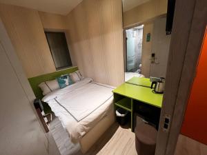 Voodi või voodid majutusasutuse 珀依旅馆 Pop E INN toas
