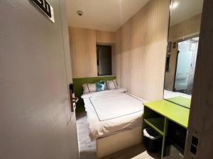 Voodi või voodid majutusasutuse 珀依旅馆 Pop E INN toas
