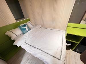 Voodi või voodid majutusasutuse 珀依旅馆 Pop E INN toas