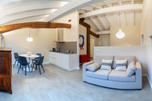 a living room with a couch and a table at Apartamentos en Baztan HIRU KABI, BAGA in Lecároz