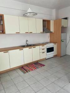 A kitchen or kitchenette at House with view the Ionian sea