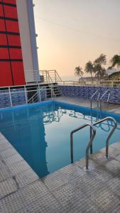 a swimming pool on the side of a cruise ship at Sunset Bay Hotel in Cox's Bazar