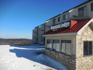 a mountain lodge building with snow in front of it at ML328A 1BR Quiet corner unit! Close to Ballhooter in Snowshoe