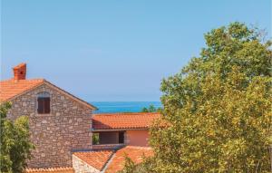 a stone building with a tree in front of it at Holiday Home Vodnjan With Fireplace I in Vodnjan +32 photos