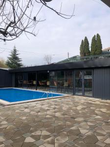 an external view of a house with a swimming pool at Astoria Luxe in Kumanovo