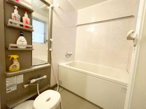 a bathroom with a shower and a toilet and a sink at Japanese style villa - Vacation STAY 10392 in Tokyo