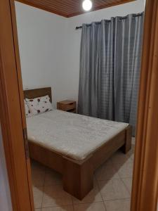 A bed or beds in a room at Vasiliki's House Zacharo , 27054 , Ilias