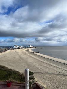 a view of a beach with the ocean at Strandhotel in Wyk auf Föhr