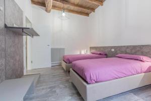 A bed or beds in a room at SDL luxury home Al Pavone