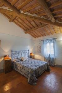 Ένα ή περισσότερα κρεβάτια σε δωμάτιο στο Agriturismo Il Fienile +30 φωτογραφίες