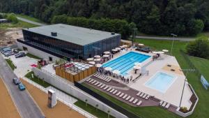 an overhead view of a swimming pool and a building at Hiša pri Bici in Slovenj Gradec