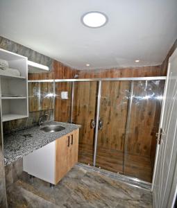 a bathroom with a shower and a sink at Garden Park in Esenyurt