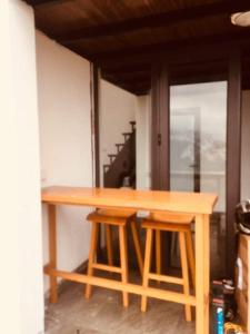 a wooden table sitting in front of a room at Bungalow view fanxipang 1579 Sa Pa in Sa Pa