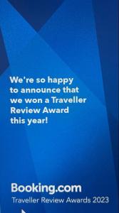 a sign that says we are happy to announce that we won a travelerreviewagency at Les pélerins in Pointe-Noire