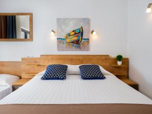 Ein Bett oder Betten in einem Zimmer der Unterkunft Hotel D'Elegant Dubrovnik