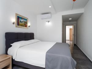 Ein Bett oder Betten in einem Zimmer der Unterkunft Hotel D'Elegant Dubrovnik