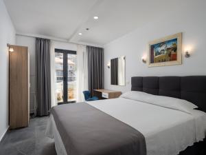 Ein Bett oder Betten in einem Zimmer der Unterkunft Hotel D'Elegant Dubrovnik