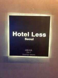 a sign for a hotel less soul on a wall at Hotel Less Seoul in Seoul